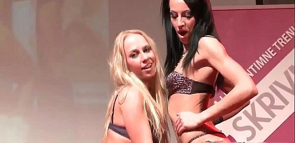  Two horny strippers get on stage to play